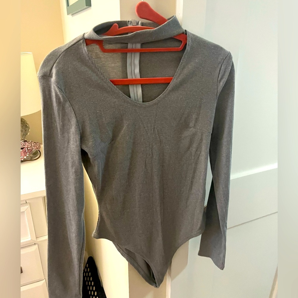 Gray bodysuit with choker neckline. Back zipper